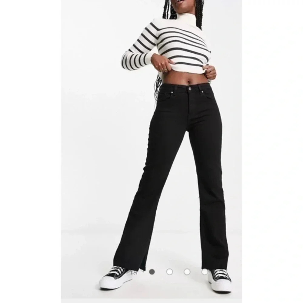 Mango flared jeans with split hem detail in black
